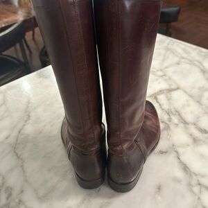 Some wear but Frye leather is a worn look. Worn twice but my feet have grown.